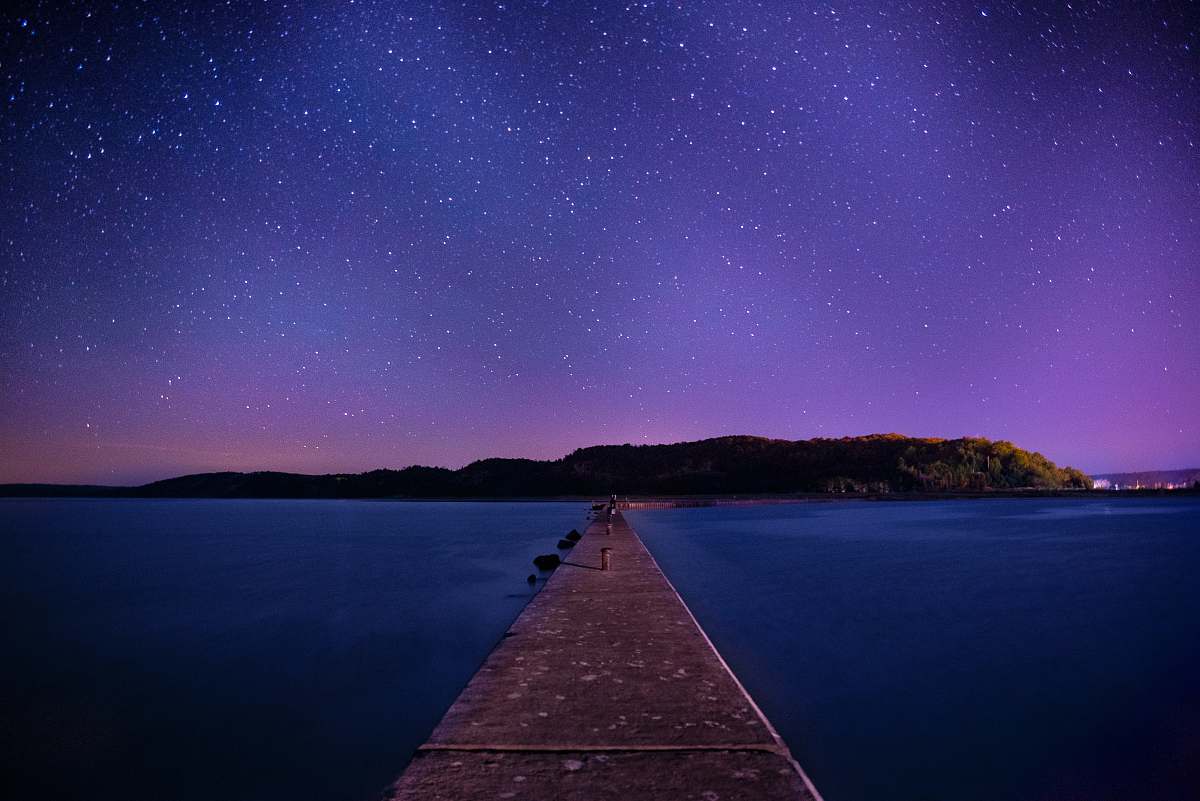 galaxy brown wooden dock under night sky pier
